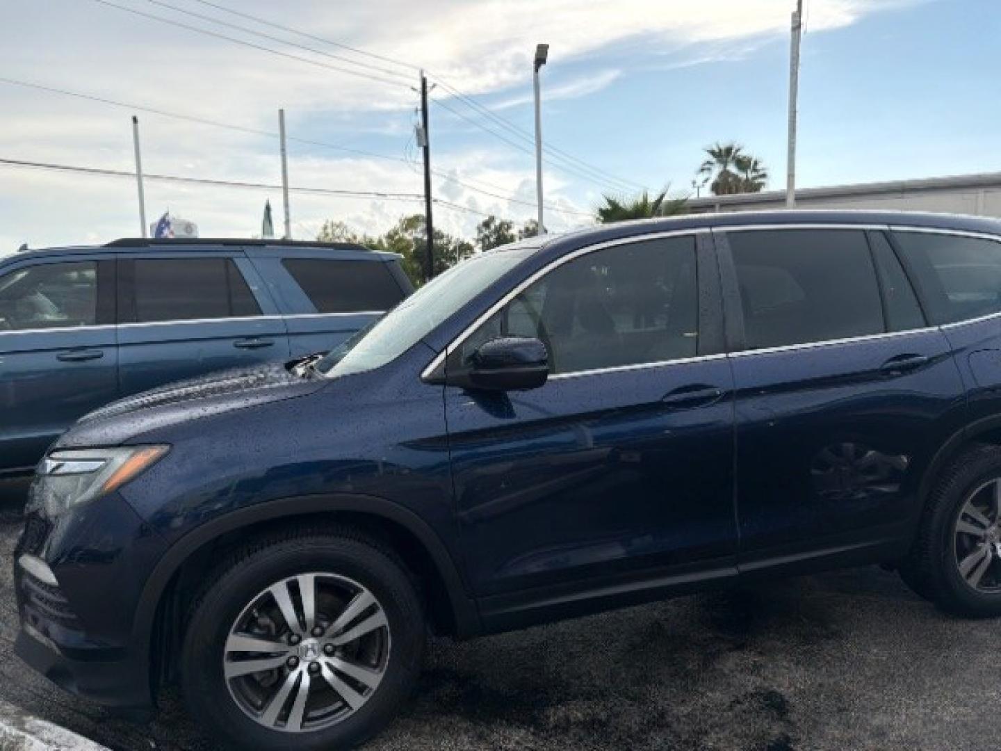 2016 Obsidian Blue Pearl /Gray Honda Pilot EX (5FNYF5H35GB) with an 3.5L V-6 gasoline direct injection engine, located at 7935 Gulf Freeway, Houston, 77017, (832) 266-1645, 29.684393, -95.275665- Photo#2