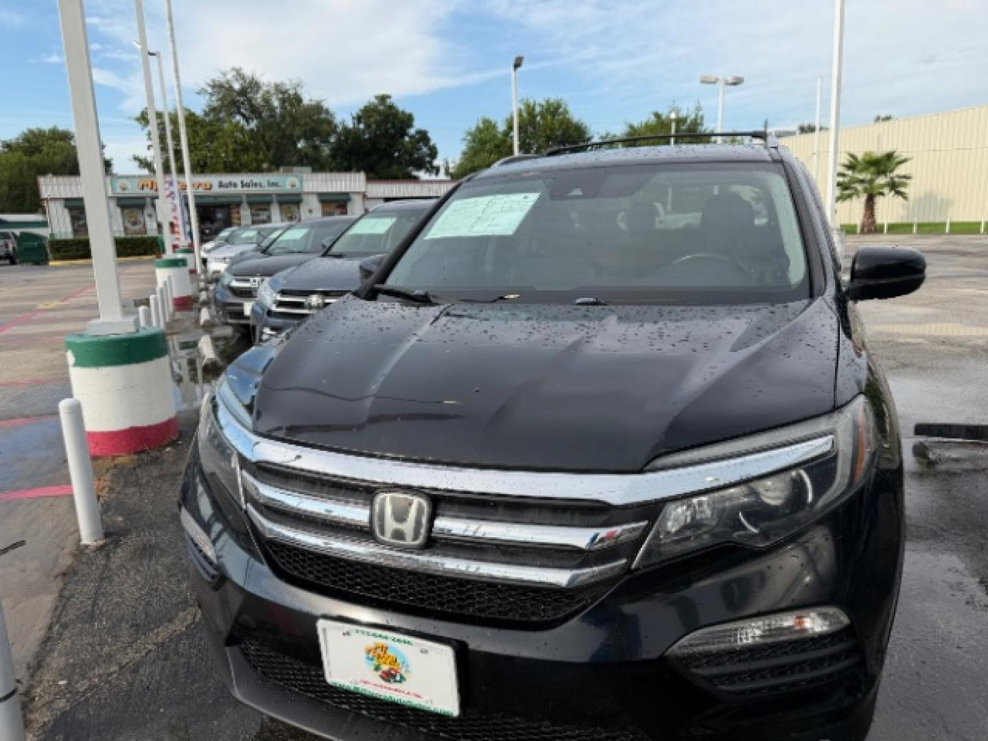 2016 Crystal Black Pearl /Black Honda Pilot EX-L (5FNYF6H62GB) with an 3.5L V-6 direct injection engine, located at 4545 Spencer Hwy., Pasadena, 77504, (832) 266-1645, 29.666037, -95.173775- Photo#0
