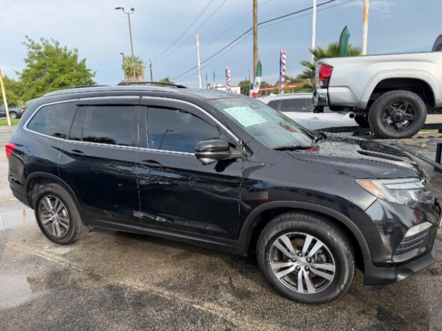 2016 Crystal Black Pearl /Black Honda Pilot EX-L (5FNYF6H62GB) with an 3.5L V-6 direct injection engine, located at 4545 Spencer Hwy., Pasadena, 77504, (832) 266-1645, 29.666037, -95.173775- Photo#2