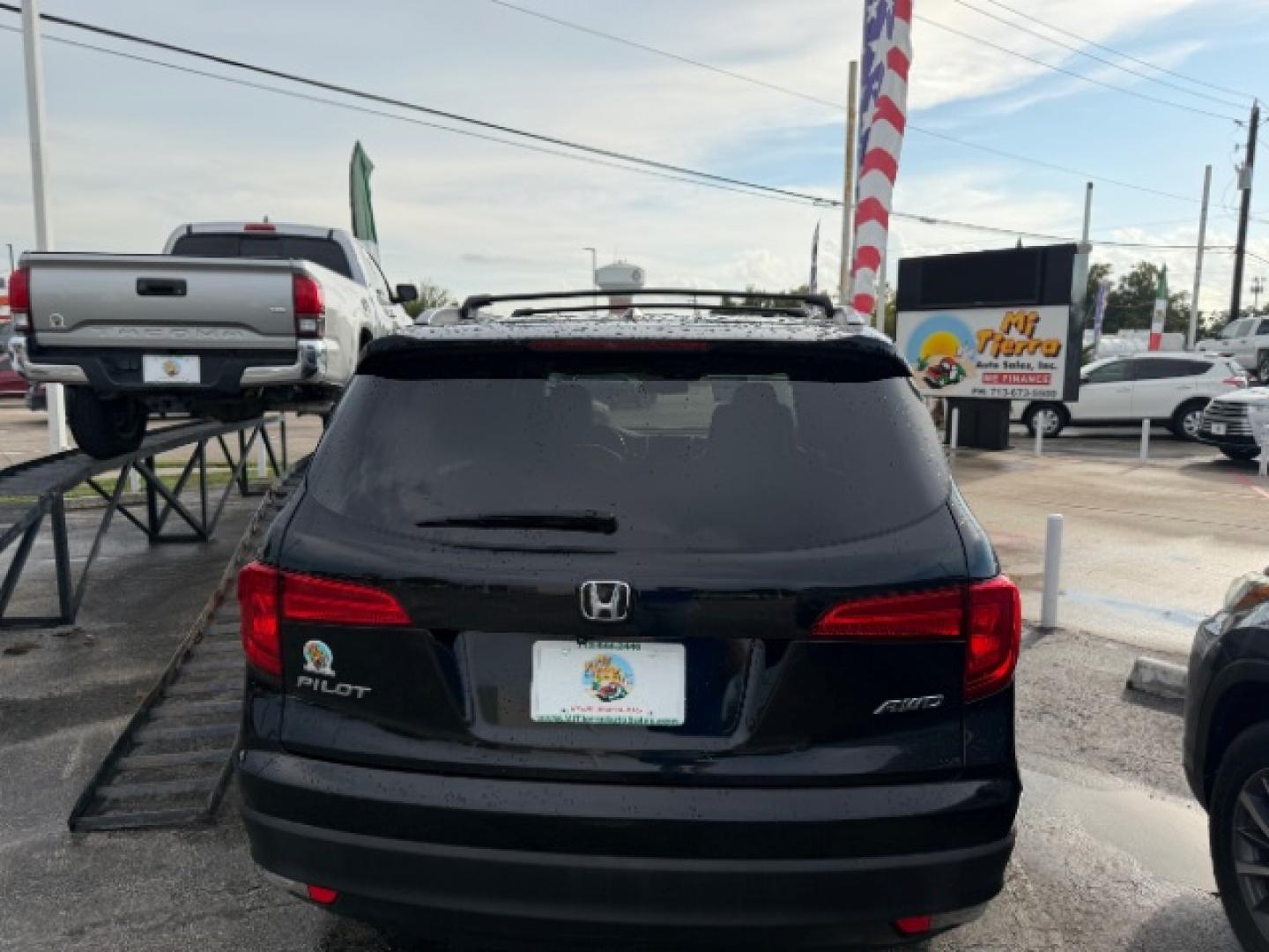 2016 Crystal Black Pearl /Black Honda Pilot EX-L (5FNYF6H62GB) with an 3.5L V-6 direct injection engine, located at 4545 Spencer Hwy., Pasadena, 77504, (832) 266-1645, 29.666037, -95.173775- Photo#3