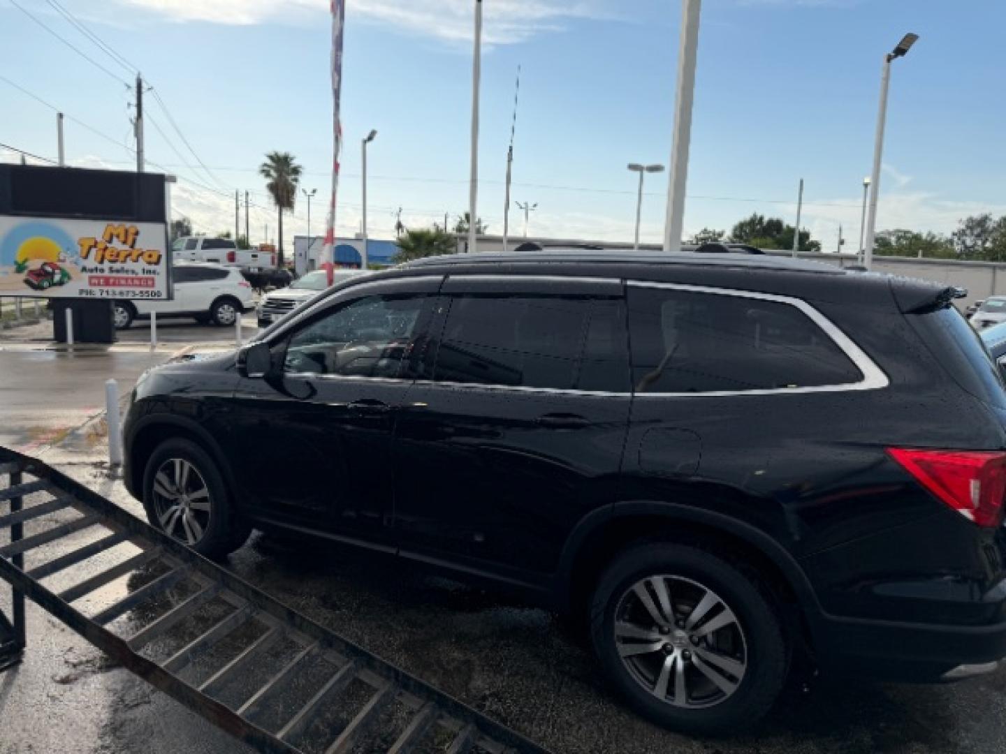 2016 Crystal Black Pearl /Black Honda Pilot EX-L (5FNYF6H62GB) with an 3.5L V-6 direct injection engine, located at 4545 Spencer Hwy., Pasadena, 77504, (832) 266-1645, 29.666037, -95.173775- Photo#5