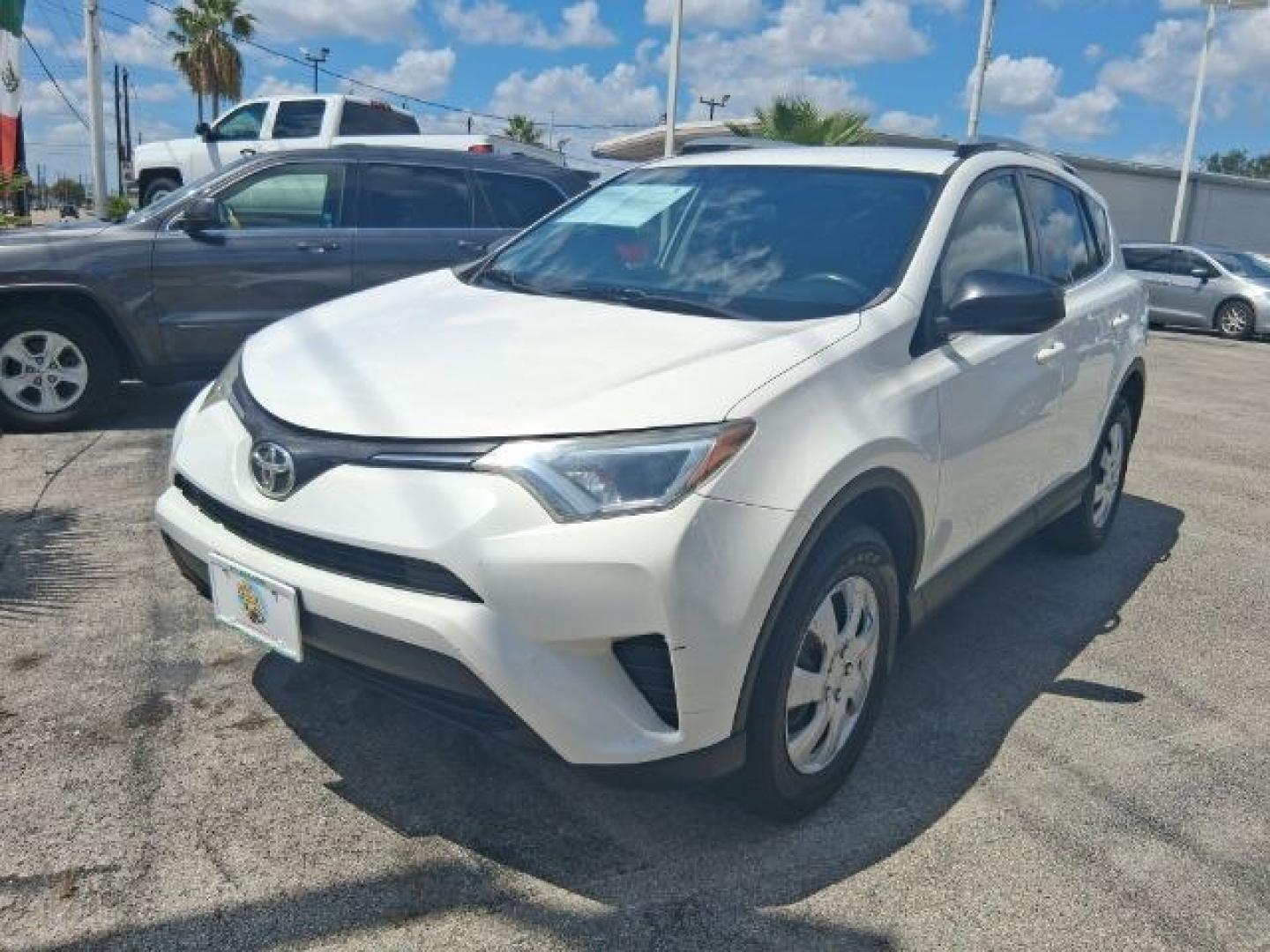 2018 Super White /Black Toyota RAV4 LE (2T3ZFREV7JW) with an 2.5L I-4 DOHC engine, located at 4545 Spencer Hwy., Pasadena, 77504, (832) 266-1645, 29.666037, -95.173775- Photo#0