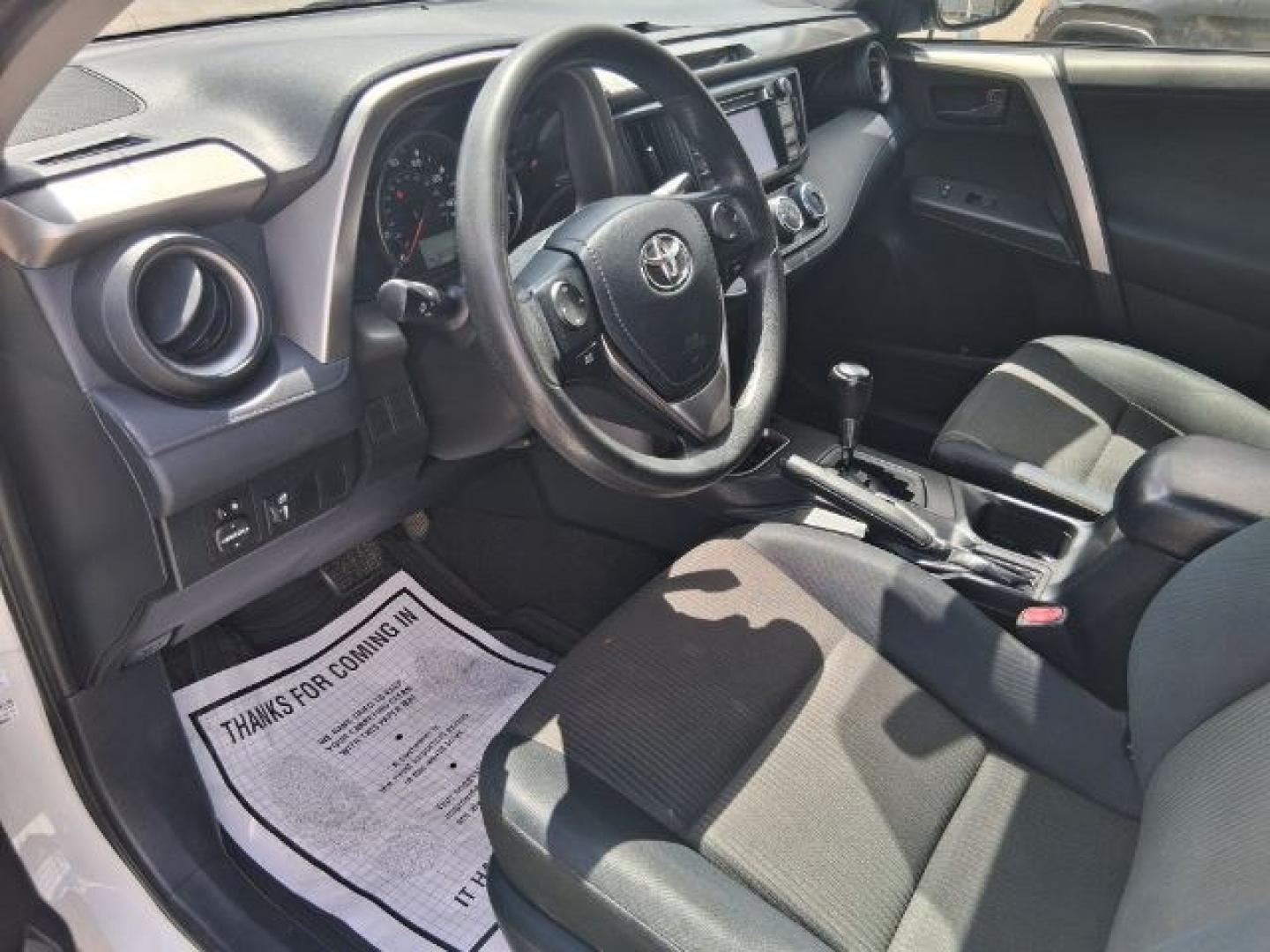 2018 Super White /Black Toyota RAV4 LE (2T3ZFREV7JW) with an 2.5L I-4 DOHC engine, located at 4545 Spencer Hwy., Pasadena, 77504, (832) 266-1645, 29.666037, -95.173775- Photo#5