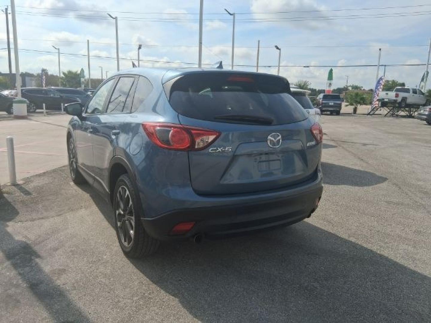 2016 Blue Reflex Mica Mazda CX-5 Grand Touring (JM3KE2DY7G0) with an SKYACTIV-G 2.5L I-4 gasoline direct injection engine, located at 4545 Spencer Hwy., Pasadena, 77504, (832) 266-1645, 29.666037, -95.173775- Photo#3