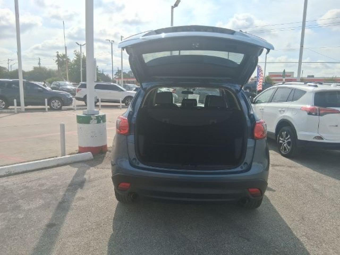 2016 Blue Reflex Mica Mazda CX-5 Grand Touring (JM3KE2DY7G0) with an SKYACTIV-G 2.5L I-4 gasoline direct injection engine, located at 4545 Spencer Hwy., Pasadena, 77504, (832) 266-1645, 29.666037, -95.173775- Photo#5