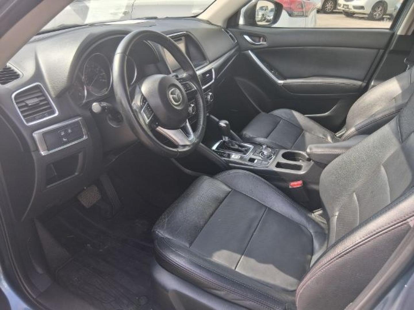 2016 Blue Reflex Mica Mazda CX-5 Grand Touring (JM3KE2DY7G0) with an SKYACTIV-G 2.5L I-4 gasoline direct injection engine, located at 4545 Spencer Hwy., Pasadena, 77504, (832) 266-1645, 29.666037, -95.173775- Photo#6