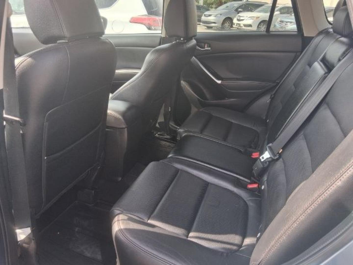 2016 Blue Reflex Mica Mazda CX-5 Grand Touring (JM3KE2DY7G0) with an SKYACTIV-G 2.5L I-4 gasoline direct injection engine, located at 4545 Spencer Hwy., Pasadena, 77504, (832) 266-1645, 29.666037, -95.173775- Photo#7
