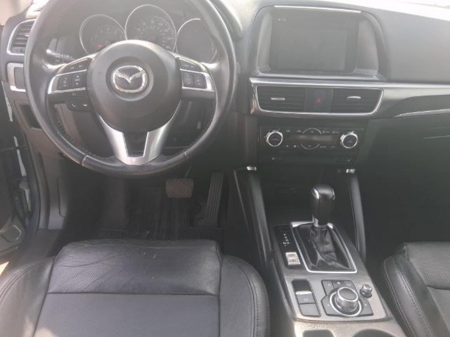 2016 Blue Reflex Mica Mazda CX-5 Grand Touring (JM3KE2DY7G0) with an SKYACTIV-G 2.5L I-4 gasoline direct injection engine, located at 4545 Spencer Hwy., Pasadena, 77504, (832) 266-1645, 29.666037, -95.173775- Photo#8
