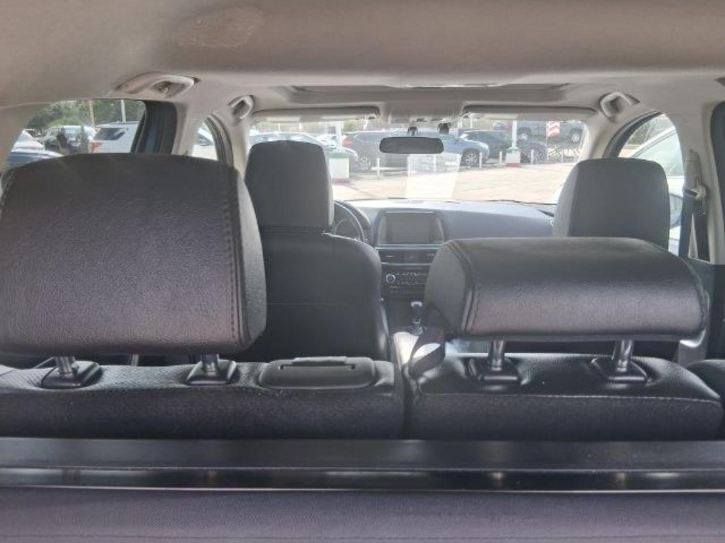 2016 Blue Reflex Mica Mazda CX-5 Grand Touring (JM3KE2DY7G0) with an SKYACTIV-G 2.5L I-4 gasoline direct injection engine, located at 4545 Spencer Hwy., Pasadena, 77504, (832) 266-1645, 29.666037, -95.173775- Photo#9